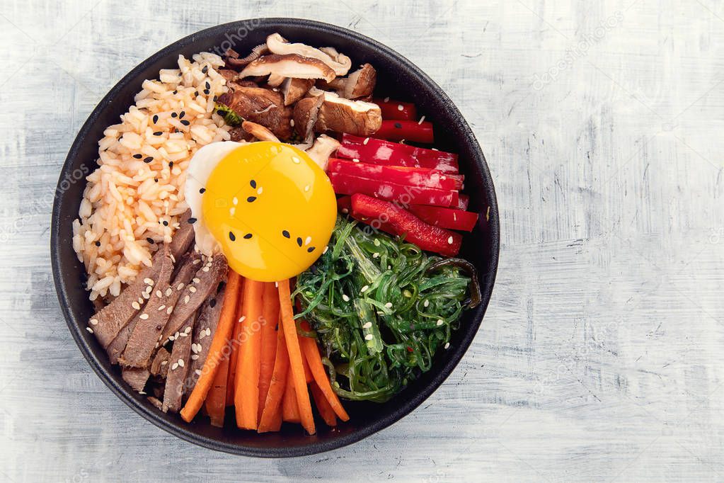 Bibimbap - traditional Korean dish with rice, vegetables, beef 