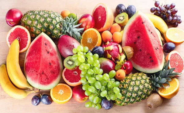 flat lay of organic kiwi fruit on green and pink Stock Photo by  LightFieldStudios