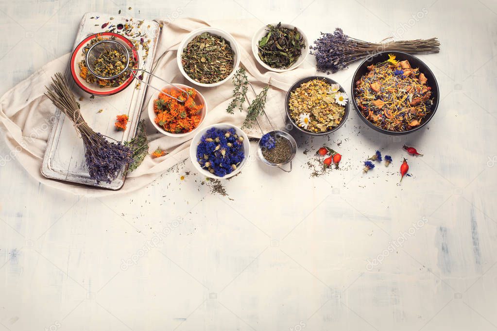 Various herbal tea ingredients on white background