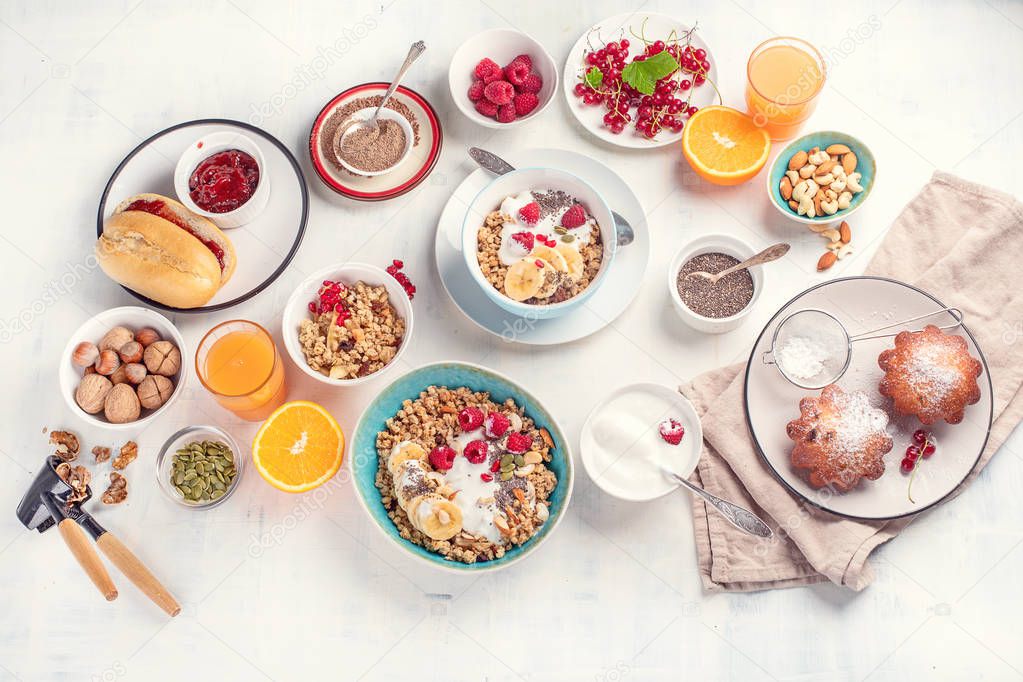 Top view of tasty breakfast ingredients on white background