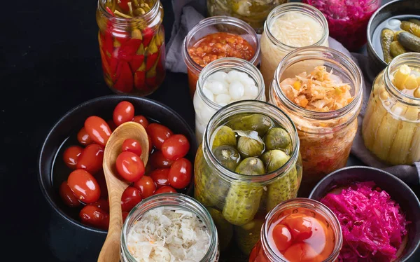 Fermented preserved food. Marinated pickles vegetables in glass jars. — Stock Image Fermented Preserved Food Marinated Pickles Vegetables Glass Jars Stock Photo