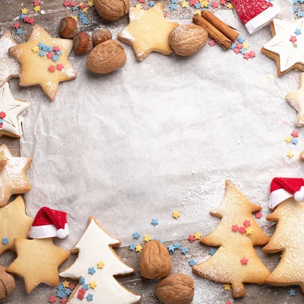 Top View Christmas Cookies Baking Paper Rustic Wooden Background — Stock Photo, Image