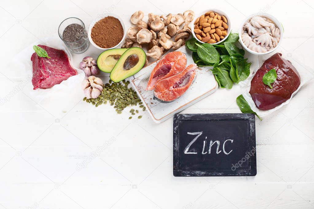 arrangement food high in Zinc on white tabletop, healthy diet concept