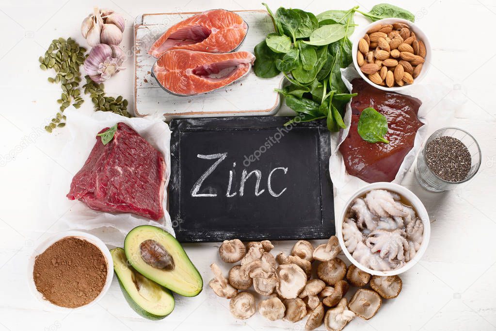 arrangement food high in Zinc on white tabletop, healthy diet concept