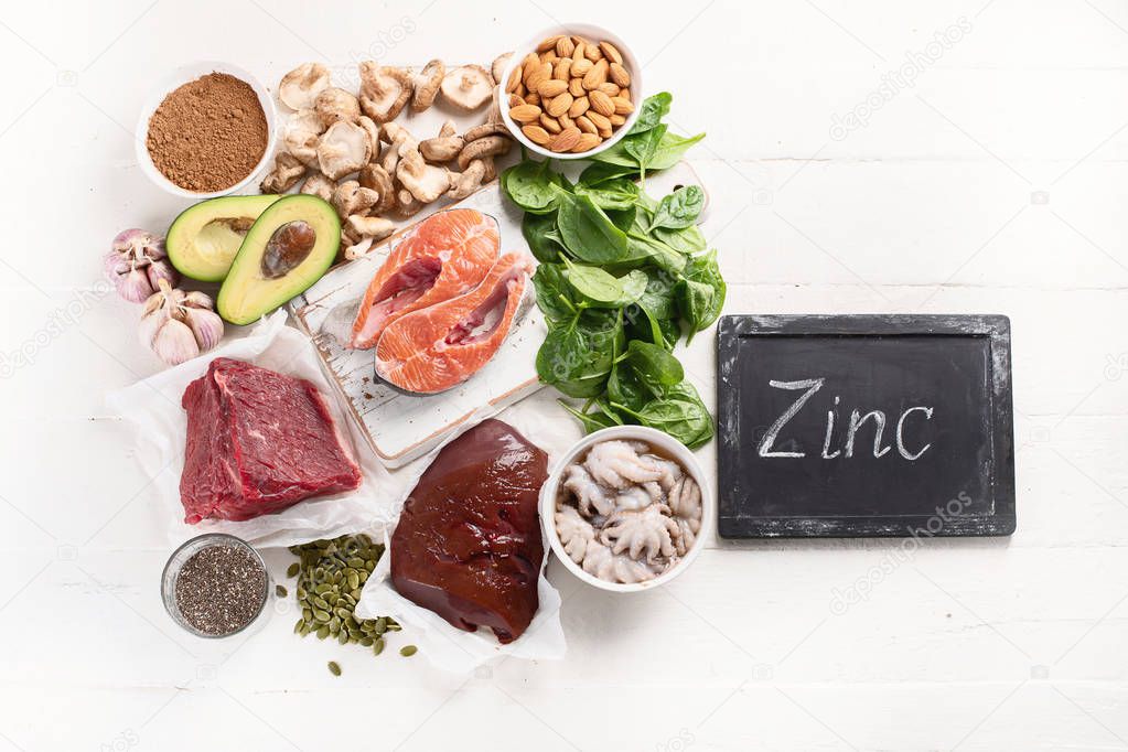 arrangement food high in Zinc on white tabletop, healthy diet concept