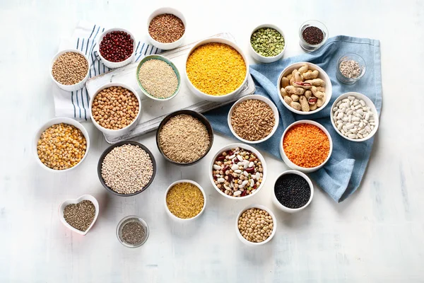 Various Grains Cereals Seeds Beans Bowls Table — Stock Photo, Image