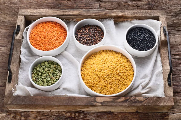 Bowls Different Types Lentils Wooden Table — Stock Photo, Image