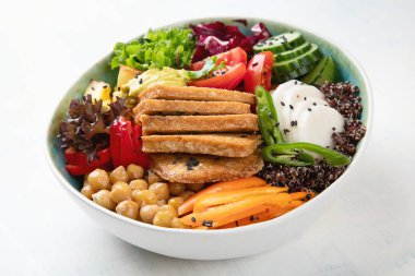 Buddha bowl with tofu.  Healthy vegan and vegetarian food concept  clipart