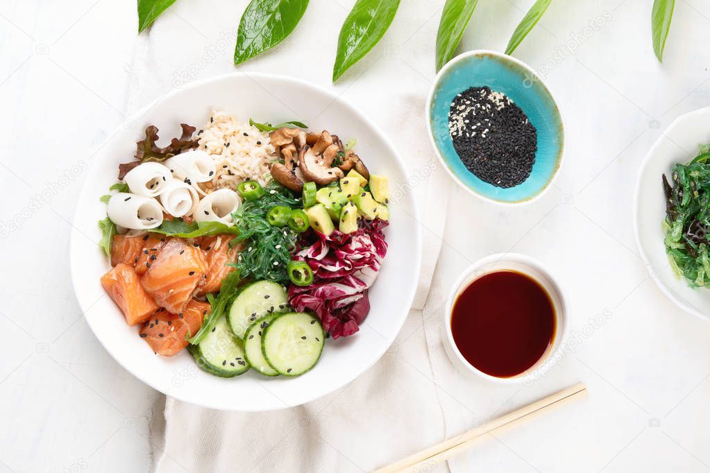 Salmon poke bowl . Top view. Flat lay. Traditional Hawaiian fish salad