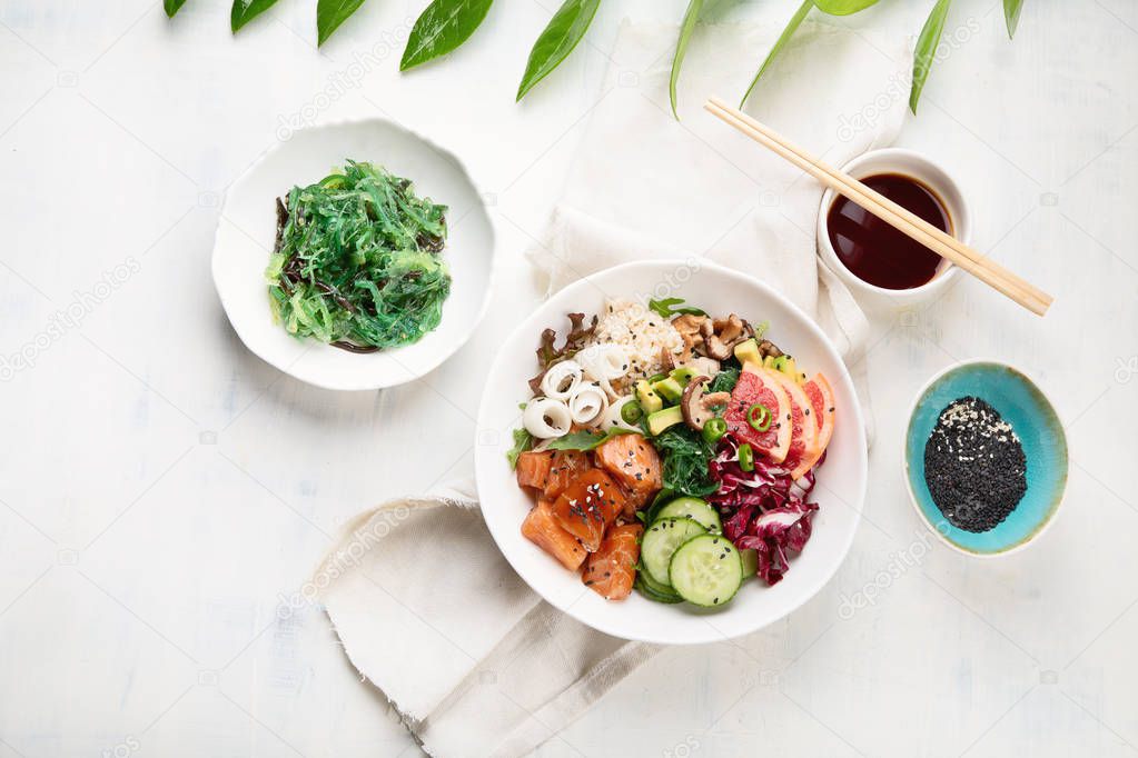 Salmon poke bowl . Top view. Flat lay. Traditional Hawaiian fish salad