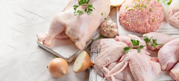 Different types of fresh chicken meat. Healthy diet eating. Top view with copy space. Panorama, banner