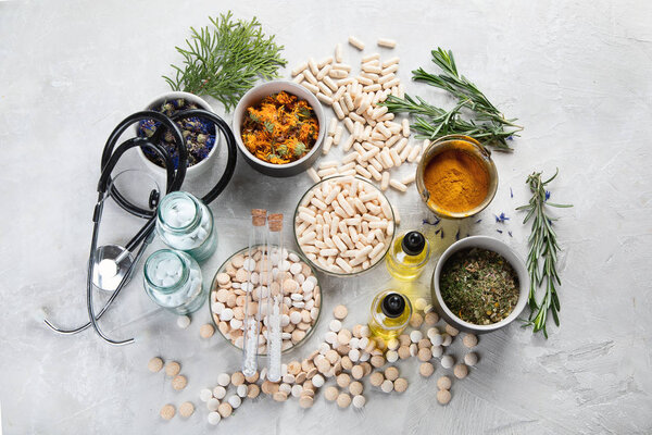 Alternative medicine herbs and homeopathic globules. Homeopathy medicine concept