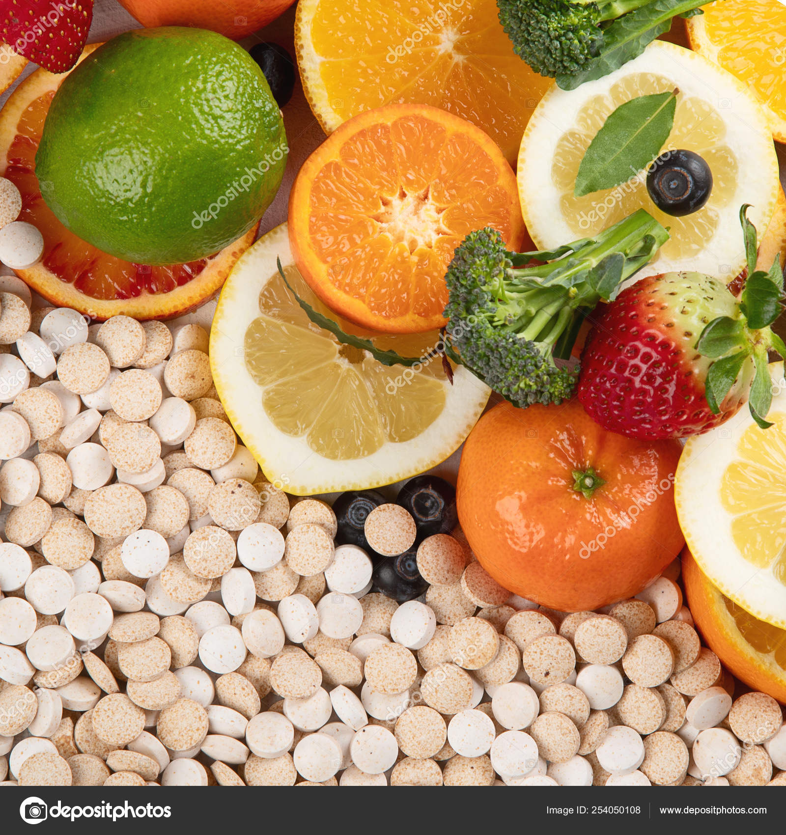 Vitamins In Fruits And Vegetables And Vitamin Pills Stock Photo By vitamins-in-fruits-and-vegetables-and-vitamin-pills-stock-photo-by