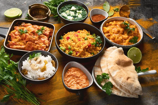 Assorted indian food on black background.. — Stock Photo, Image