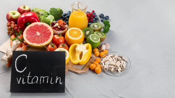 Foods high in vitamin C. Food rich in antioxidant, fiber, carbohydrates. Boost immune system and brain; balances cholesterol; promotes healthy heart. Copy space , with chalkboard