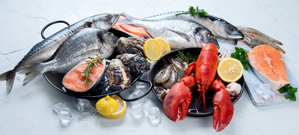Assortment of fresh raw fish and seafood. Healthy and balanced diet or cooking concept. 
