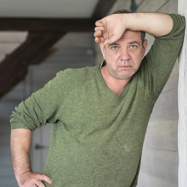 Sad Mature Caucasian Man Green Jumper Stands Leaning His Back — Stock Photo, Image