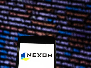 Kiev, Ukrayna - 9 Kasım 2018: Nexon Video görülen oyun şirket logosu görüntülenen akıllı telefon. PC ve mobil online-oyunlarda uzmanlaşmış bir Korece-Japonca video oyunu şirket NEXON Co Ltd.. 