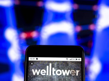 Kiev, Ukrayna - 9 Ocak 2019: Welltower gerçek emlak yatırım güven şirket logosu akıllı telefon görüntülenen gördüm.