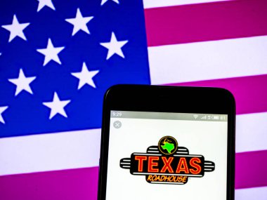 Kiev, Ukrayna - 16 Şubat 2019: akıllı telefon görülen Amerikan zinciri Restoran logosu görüntülenen Texas Motel