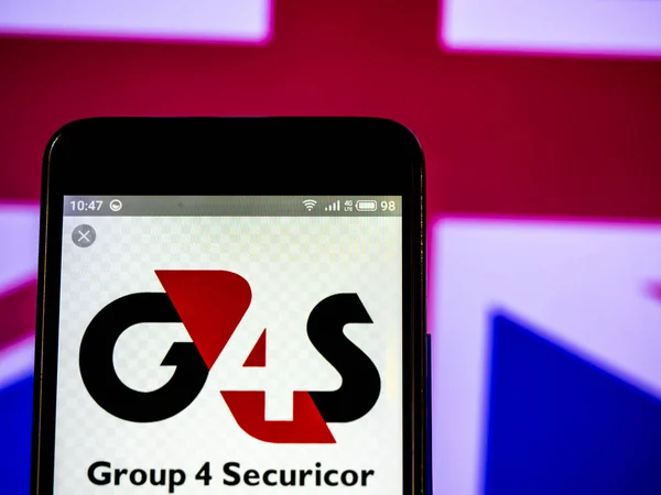G4s plc 회사 로고는 스마트 폰에 표시 된 볼. — 스톡 사진