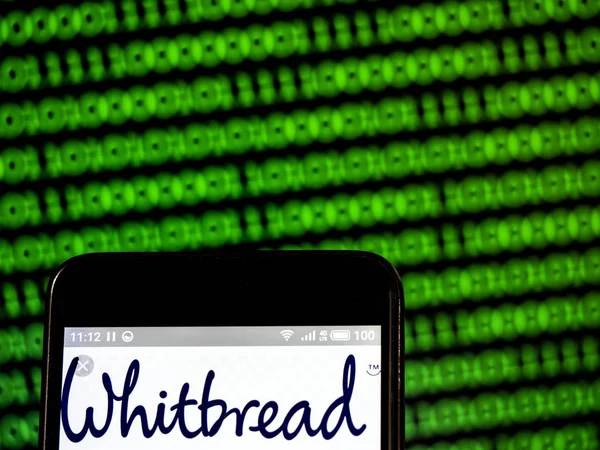 Whitbread plc 회사 로고는 스마트 폰에 표시 된 볼. — 스톡 사진