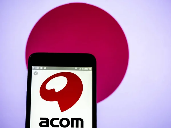 Acom 회사 로고는 스마트 폰에 표시 된 볼. — 스톡 사진