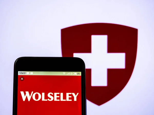 Photo illustration a Wolseley logo seen displayed on a smart pho — Stock Photo, Image