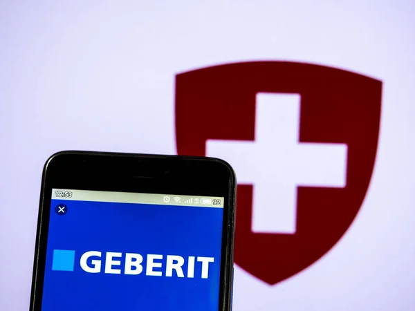 In this photo illustration a  Geberit AG logo seen displayed on — Stock Photo, Image