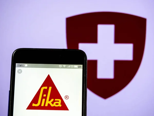 In this photo illustration a Sika AG  logo seen displayed on a s — Stock Photo, Image