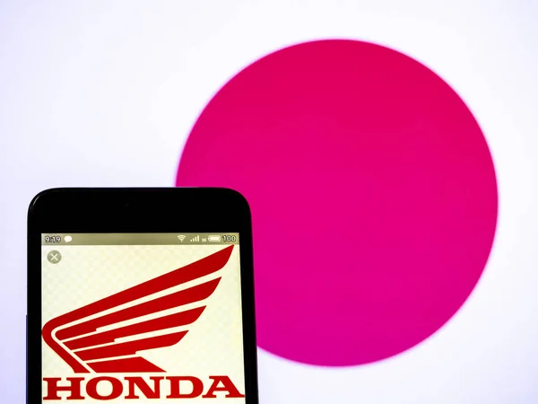 I detta foto illustration en Honda Motor Co, Ltd logo ses dis — Stockfoto