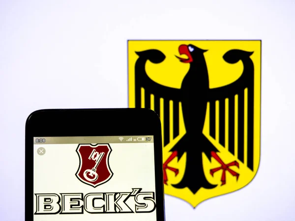 In this photo illustration a Beck���s logo seen displayed on a s — стокове фото