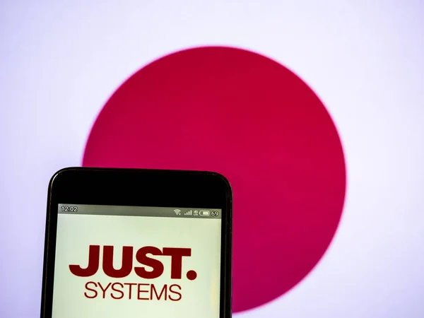In this photo illustration a JustSystems Corporation logo seen d — Stock Photo, Image