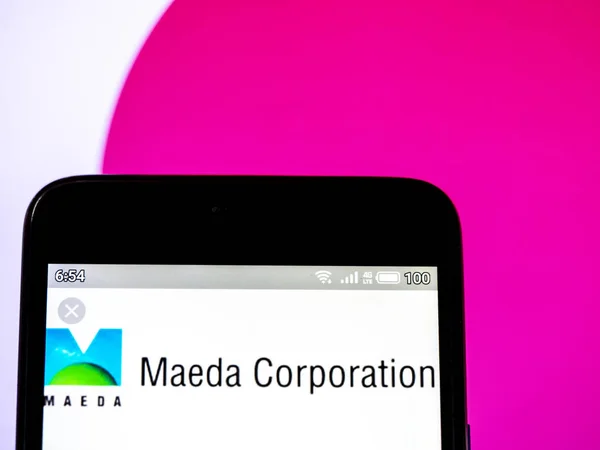 Nesta foto ilustração um logotipo Maeda Corporation visto exibição — Fotografia de Stock