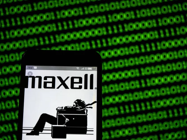 In this photo illustration a Maxell Holdings, Ltd. logo seen dis — Stock Photo, Image