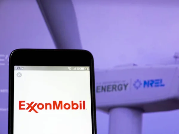 In this photo illustration the Exxon Mobil Corporation logo is s — Stock Photo, Image