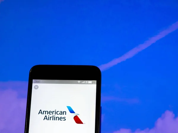 KIEV, UKRAINE - June 7, 2019: IIn this photo illustration the American Airlines logo is seen displayed on a smartphone