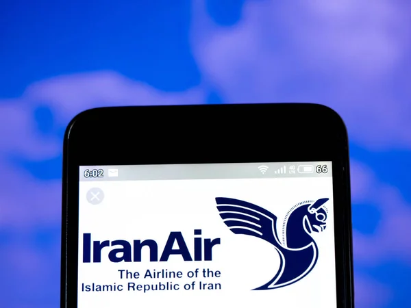 In this photo illustration the Iran Air logo is seen displayed o — Stock Photo, Image