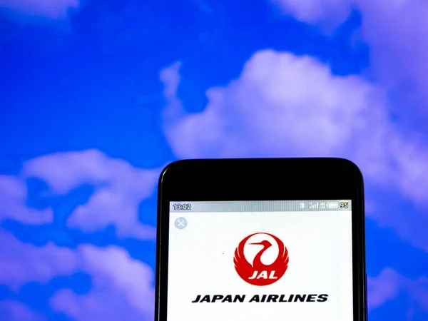In this photo illustration the Japan Airlines Co., Ltd. (JAL) lo — Stock Photo, Image