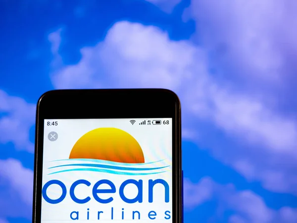 In this photo illustration the Ocean Airlines logo is seen displ — Stock Photo, Image