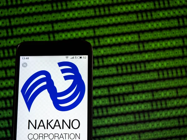 Nesta foto ilustração o logotipo da Corporação Nakano é visto d — Fotografia de Stock
