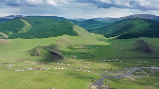 Aerial view of yurts in steppe and mountains — Stok video