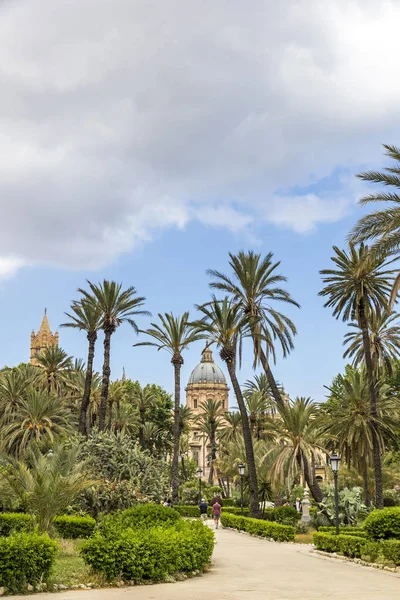 Villa Bonanno, the public garden in center of Palermo city, Sicily, Italy. Named after the mayor of Palermo, Pietro Bonanno. Tower of Arcidiocesi di Palermo Cathedral on the background