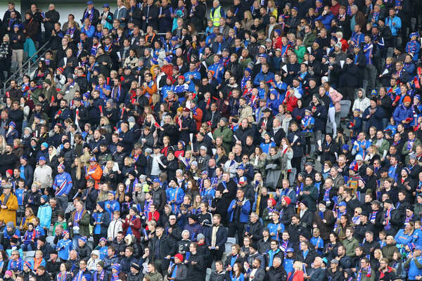 REYKJAVIK, ICELAND - SEPTEMBER 5, 2017: Iceland National Team supporters on tribunes of Laugardalsvollur stadium in Reykjavik during FIFA World Cup 2018 qualifying game Iceland v Ukraine