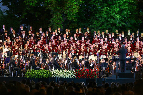 KYIV, UKRAINE - JULY 1, 2018: Orchestra Giovanile Luigi Cherubini (conductor Riccardo Muti) and Choir of the National Opera of Ukraine perform on stage during the concert at Sofiyivska Square in Kyiv
