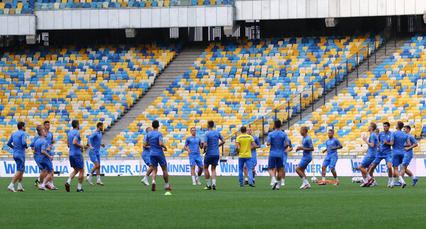 KYIV, UKRAINE - SEPTEMBER 4, 2018: Players run during Open training session of Ukraine National Football Team at NSC Olimpiyskyi stadium in Kyiv, Ukraine