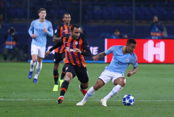 KHARKIV, UKRAINE - OCTOBER 23, 2018: Ismaily of Shakhtar Donetsk (L) fights for a ball with Gabriel Jesus of Manchester City during their UEFA Champions League game at OSK Metalist stadium in Kharkiv