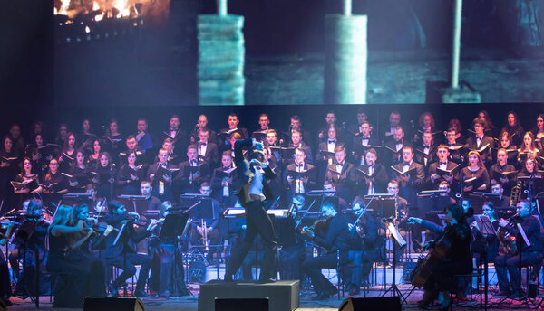 KYIV, UKRAINE - NOVEMBER 22, 2018: Symphony Orchestra (conductor Andrey Chernyi) and Choir "Voice of the Sympho Rock" perform soundtracks from "The Game of Thrones" on stage of National Palace of Arts