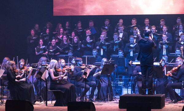 KYIV, UKRAINE - NOVEMBER 22, 2018: Symphony Orchestra (conductor Andrey Chernyi) and Choir "Voice of the Sympho Rock" perform soundtracks from "The Game of Thrones" on stage of National Palace of Arts