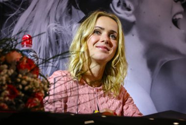 KYIV, UKRAINE - NOVEMBER 9, 2018: Ukrainian tennis player Elina Svitolina smiles as she attends a meeting with her fans during an autograph session in Kyiv. Elina Svitolina - first Ukrainian player, who won the WTA Finals clipart